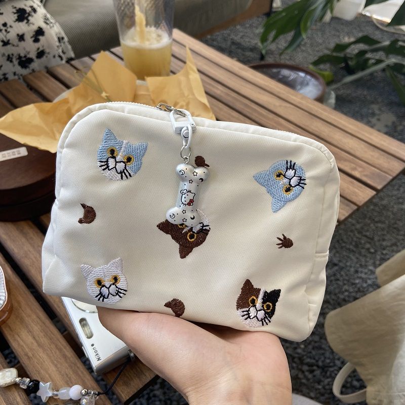 93d2b7d3-1d22-4ccc-a2b3-f49e58a10c4c Cute Embroidered Cat Makeup Bag – Travel Pouch for Cosmetics, Period Essentials & Lipstick Storage - Image 1
